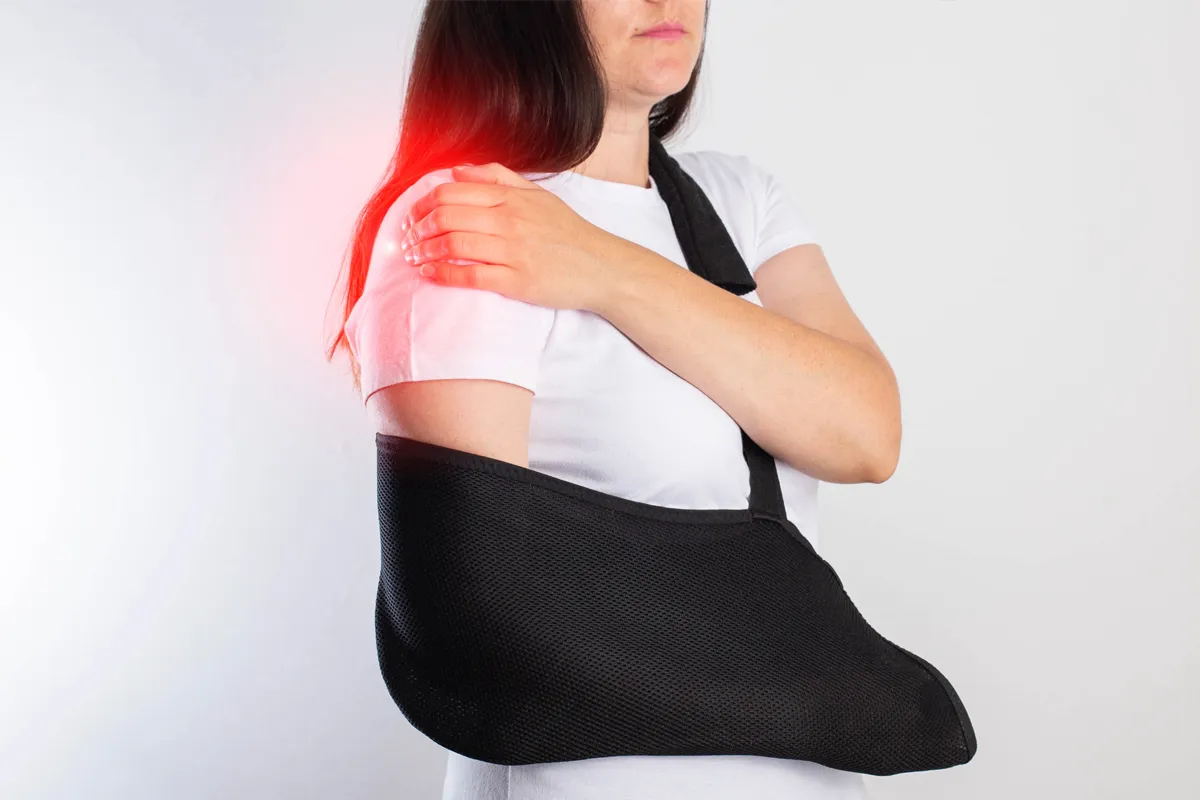 Woman wearing a sling after shoulder surgery